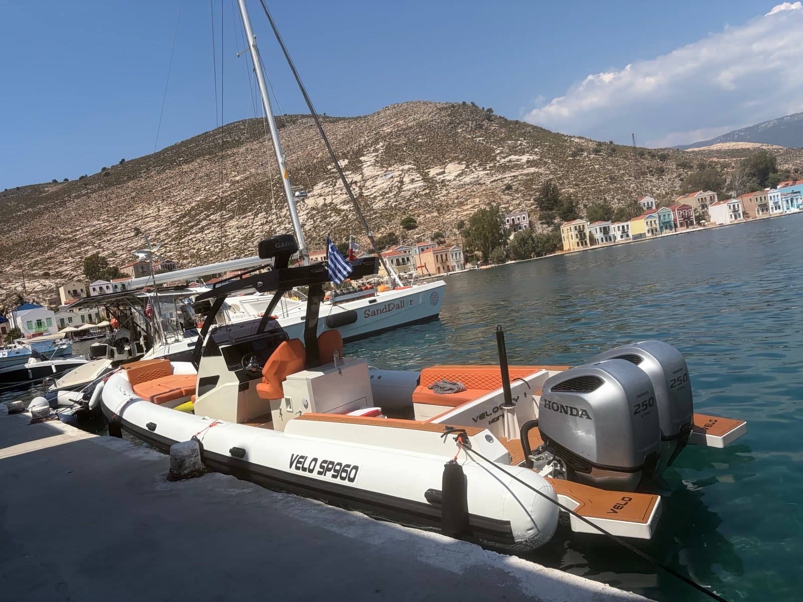 VELOCITY 1 moored in Kastellorizo harbour.